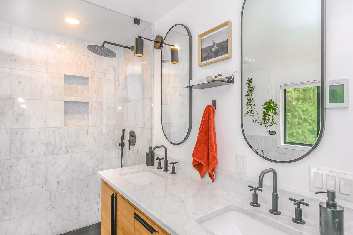 Industrial style bathroom with concrete walls, matte black fixtures, and warm wood accents