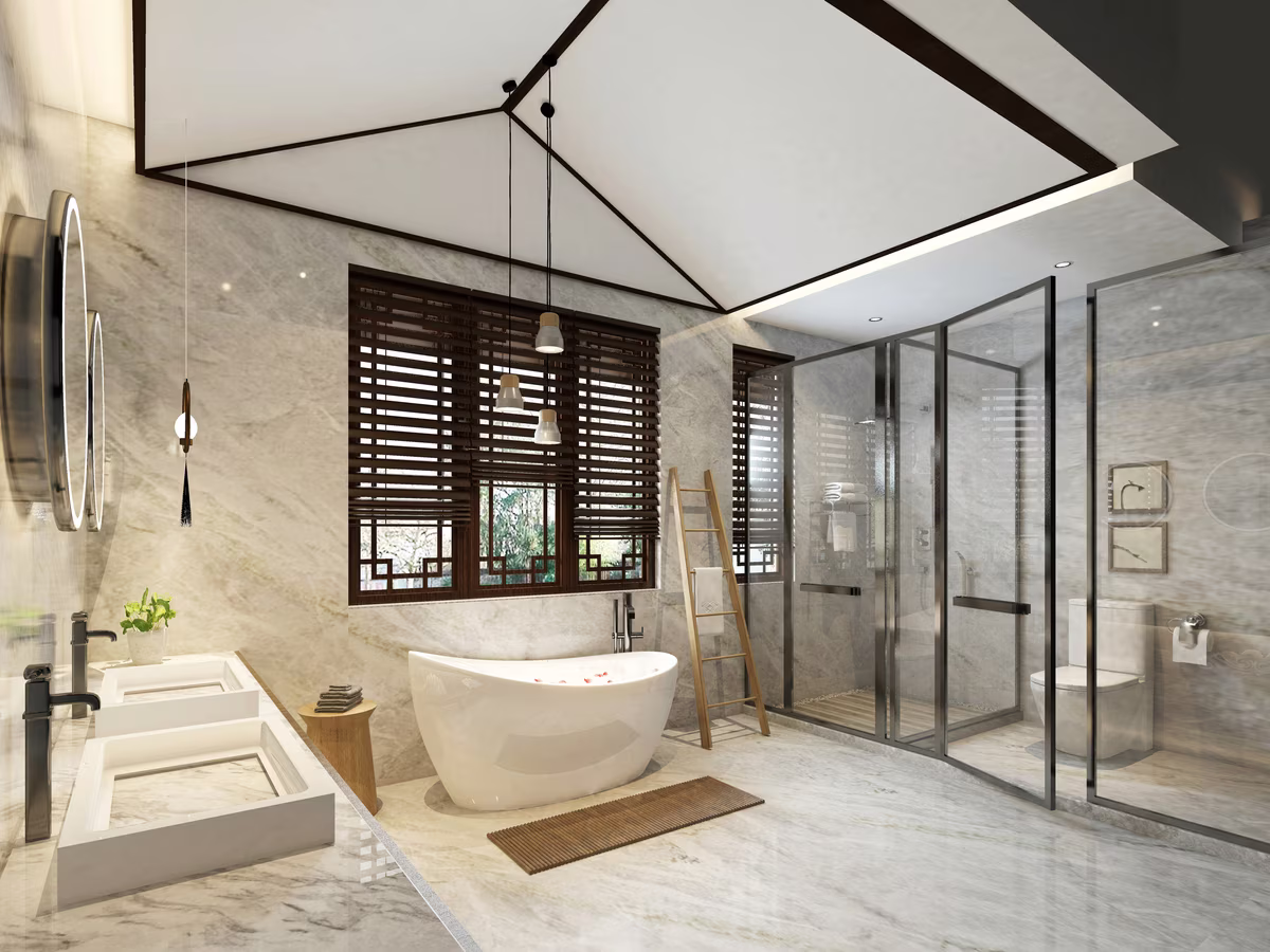 Luxury bathroom with vaulted ceiling, freestanding tub, wooden window screens, and marble surfaces