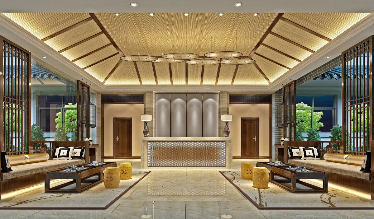 Elegant traditional lobby with wooden seating, decorative ceiling, and warm lighting