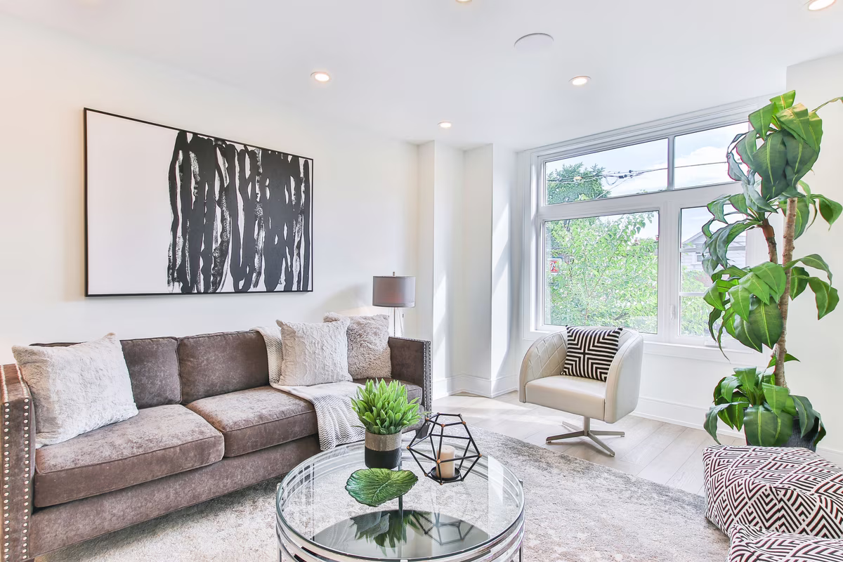 Contemporary living room with abstract artwork and velvet sofa