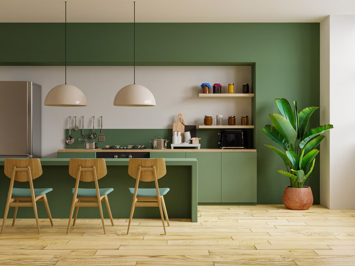 Modern sage green kitchen with wooden accents and contemporary pendant lighting