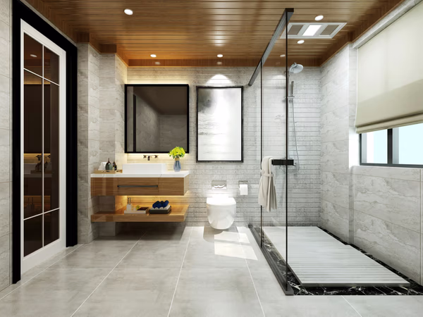 Modern bathroom with wooden ceiling, floating vanity, and black-framed glass shower