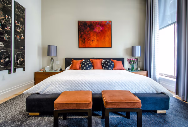 Contemporary Asian fusion bedroom with orange and navy accents