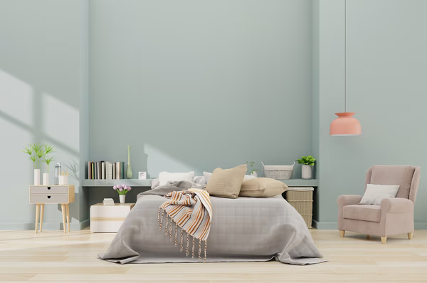Scandinavian minimalist bedroom with sage walls and coral accents