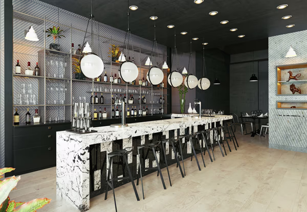 Modern minimalist bar with marble countertop, sleek bar stools, and contemporary lighting