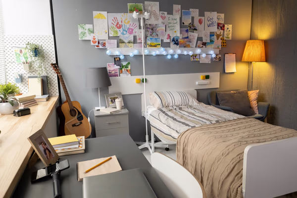 Teen bedroom with creative wall gallery, study desk, and musical corner