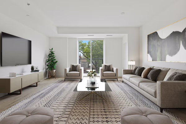 Modern living room with geometric rug and grey sectional