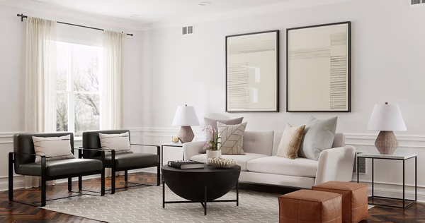Modern classic living room with linear artwork and black accent chairs