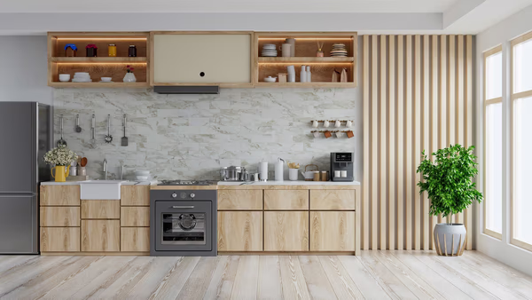 Modern linear kitchen with light wood cabinets, marble backsplash, and wooden slat wall feature